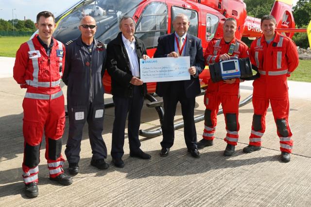 Nick Maston presents cheque to Air Ambulance for Henry Surtees Foundation